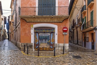 Mural painting on a jalousie to a street corner restaurant in the old town of Palma, Palma de