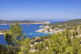 Seascape view at a coastal village on the Mediterranean Sea with a rocky coastline and lush green