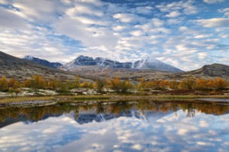 Autumn landscape in Rondane National Park, mountains Høgronden, Midtronden and Digerronden Dørålen,