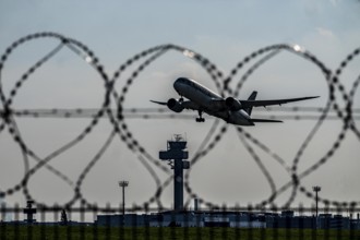 Symbolic image security at the airport, outer fence at Düsseldorf International Airport, steel wire