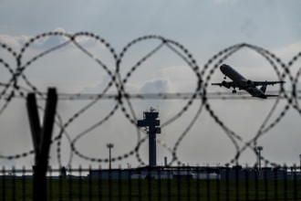 Symbolic image security at the airport, outer fence at Düsseldorf International Airport, steel wire