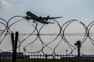 Symbolic image security at the airport, outer fence at Düsseldorf International Airport, steel wire