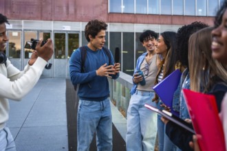 Students on university campus creating social media content, interviewing for a vlog or podcast,