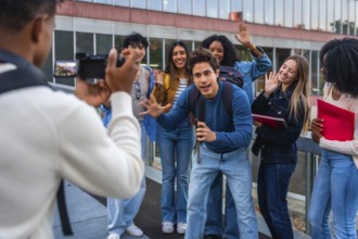 University student filming diverse group of friends on campus, capturing authentic smiles and