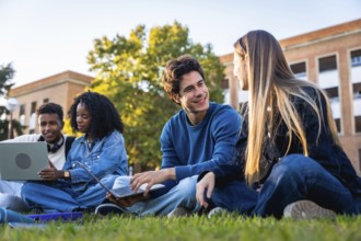 Group of diverse university students collaborating, studying, and engaging in conversations on the
