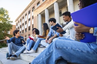 Group of diverse university students sitting on campus steps, discussing and sharing ideas in an