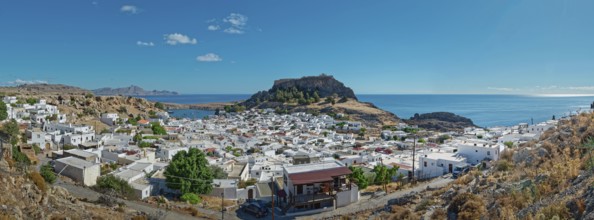 Panoramic view of the town of Lindos with Acropolis on the coast with a blue sky, Acropolis,