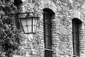 Old stone façade, historic lantern, Mühletorplatz, Feldkirch, Vorarlberg, Austria