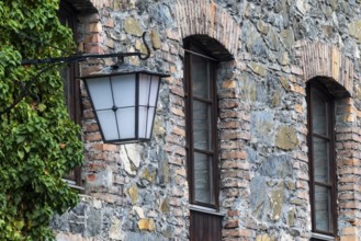 Old stone façade, historic lantern, Mühletorplatz, Feldkirch, Vorarlberg, Austria