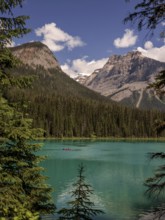 Kayak on Emerald Lake encircled by the Canadian Rocky Mountains and forest within Yoho National