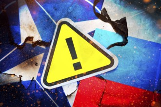 The flags of NATO and Russia with danger sign, photomontage