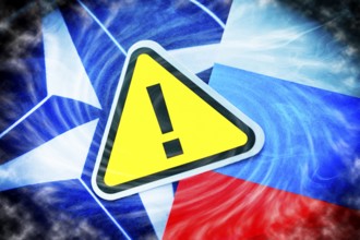 The flags of NATO and Russia with danger sign, photomontage