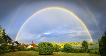 Double rainbow over the Großer Pönitzer See in Pönitz am See, Schleswig-Holstein, Germany