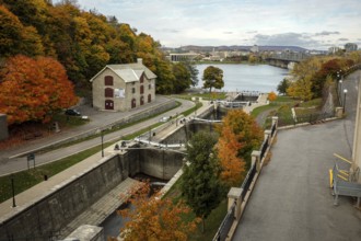 Elevated view of the Rideau canal and locks leading to the Ottawa River, lined by an autumn path