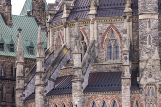 The Canadian Parliament building in gothic style with ornate stonework and a green roof in Ottawa,