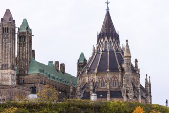The Canadian Parliament Buildings with Gothic architecture, featuring towers and a prominent spire