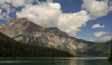 Serene mountain view of the Canadian Rocky Mountains with clear Emerald Lake reflecting a dramatic