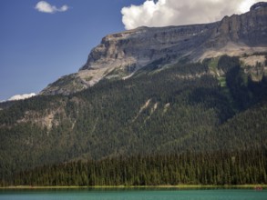 Tranquil Emerald Lake with clear blue water and forested mountains of the Canadian Rocky Mountains