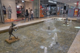 Shops and fountain with frog king in Forum Allgäu, Kempten, Allgäu, Swabia, Germany