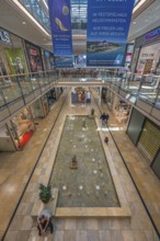 Shops and fountain with frog king in Forum Allgäu, Kempten, Allgäu, Swabia, Germany