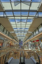Shops, escalator and skylight in Forum Allgäu, Kempten, Allgäu, Swabia, Germany
