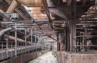 Weathered rusty industrial scenery with old corroded steel girders and metal tubes