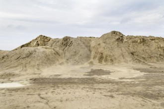 Outdoor shot of a light brown heap of earth