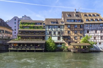 Idyllic waterside impression around a district named Petite France in Strasbourg, a city at the