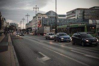 Busy evening traffic on a city road, surrounded by modern buildings in Helsingborg, Sweden,