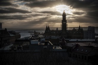 A silhouetted tower during sunset with a dramatic cloudscape and looking out to the Oresund Strait,