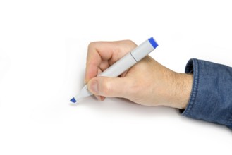 Male hand with felt tip pen in light back