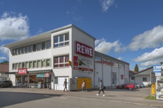 Blue sky. white clouds, REWE store in Haubenschloßstraße, Kempten, Allgäu, Swabia, Germany