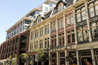 Row of historic buildings with ornate facades under a clear blue sky in Toronto, Ontario, Canada,