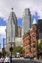 A mix of historic and modern buildings under a bright sky in Toronto, Ontario, Canada, North