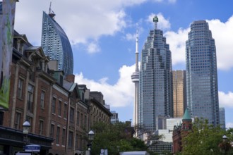 Toronto's skyline with the CN Tower and historic buildings on a sunny day in Toronto, Ontario,
