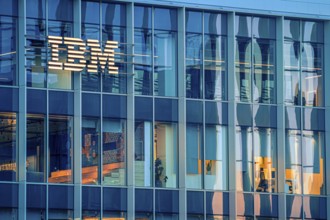 Jan 16, 2025 - Lisbon, Portugal: Day view of IBM office building with glowing logo and sleek glass