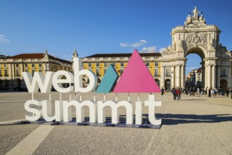 Nov 13, 2024 - Lisbon, Portugal: Web Summit sign displayed at Commerce square on sunny day under