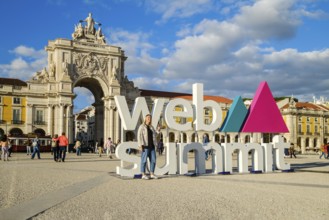 Nov 13, 2024 - Lisbon, Portugal: A female adult posing for a photo in front of Web Summit sign