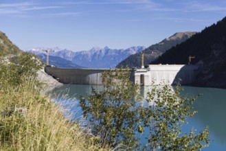 Waterfall bottom reservoir, dam wall, construction site, mountain panorama, energy industry, hiking