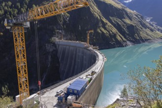 Waterfall bottom reservoir, dam wall, construction site, mountain panorama, energy industry, hiking