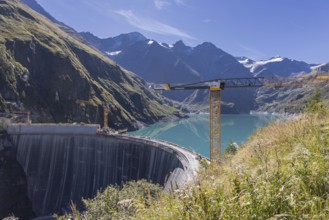 Waterfall bottom reservoir, dam wall, construction site, mountain panorama, energy industry, hiking