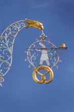 Nose sign, baker figure with Gugelhupf in Kisslegg, Allgäu, Baden-Württemberg, Germany