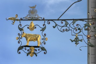 Wrought iron nose plate with golden bull in Kisslegg, Allgäu, Baden-Württemberg, Germany