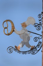 Nose sign, baker figure with pretzel in Kisslegg, Allgäu, Baden-Württemberg, Germany