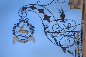 Nose sign with golden stag of the Deer-Post restaurant in Kisslegg, Allgäu, Baden-Württemberg,