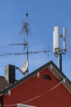 Red pointed gable with antennas and chimney, Allgäu, Baden-Württemberg, Germany