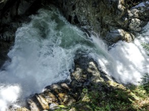 Powerful water flow over rocks in a forest setting inside Cascade Falls Regional Park, Deroche,