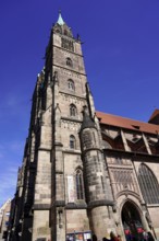 Noble Gothic church with impressive façade and bright blue sky in the background, Church of St.