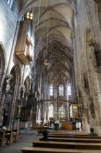 Large nave with impressive Gothic architecture and stained glass windows, St. Lawrence Church,