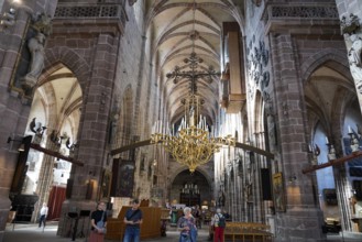 Spacious church interior with high vaults and magnificent chandelier, St. Lawrence Church,